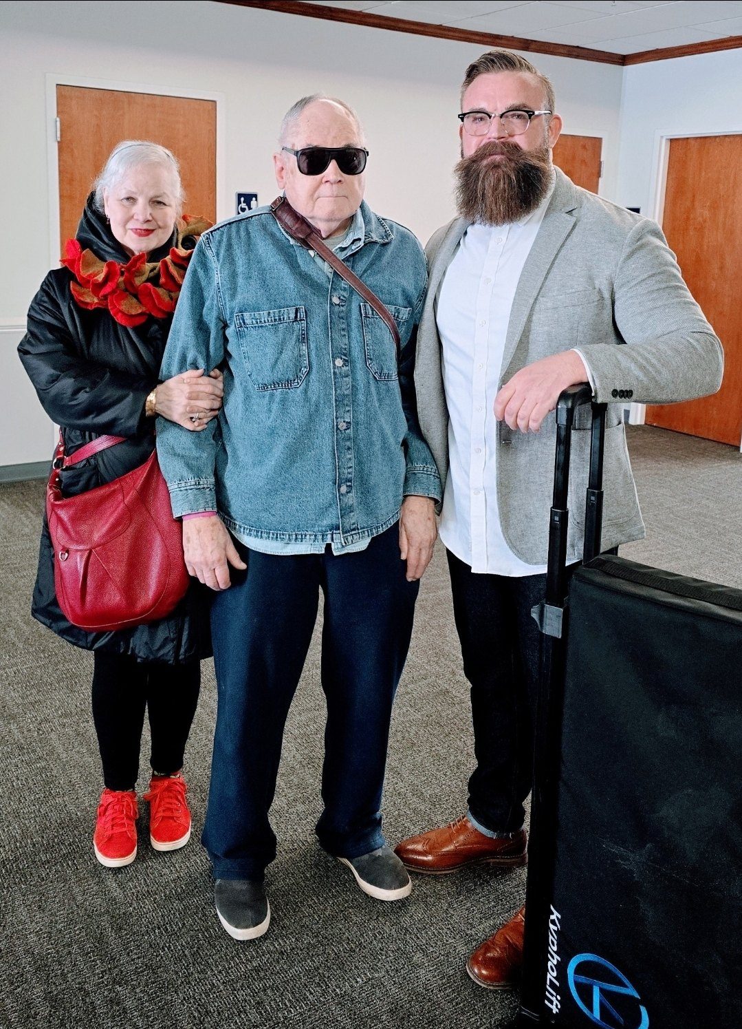Brandon Johnson with William and Christine Marks